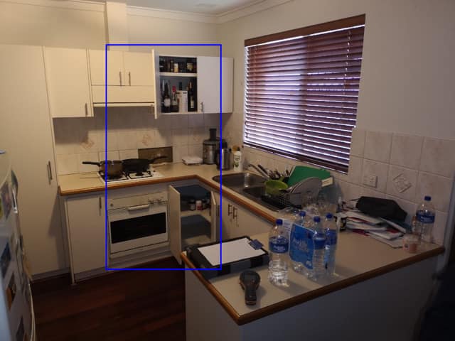 Kitchen before renovation: dated cupboards and cluttered benchtops