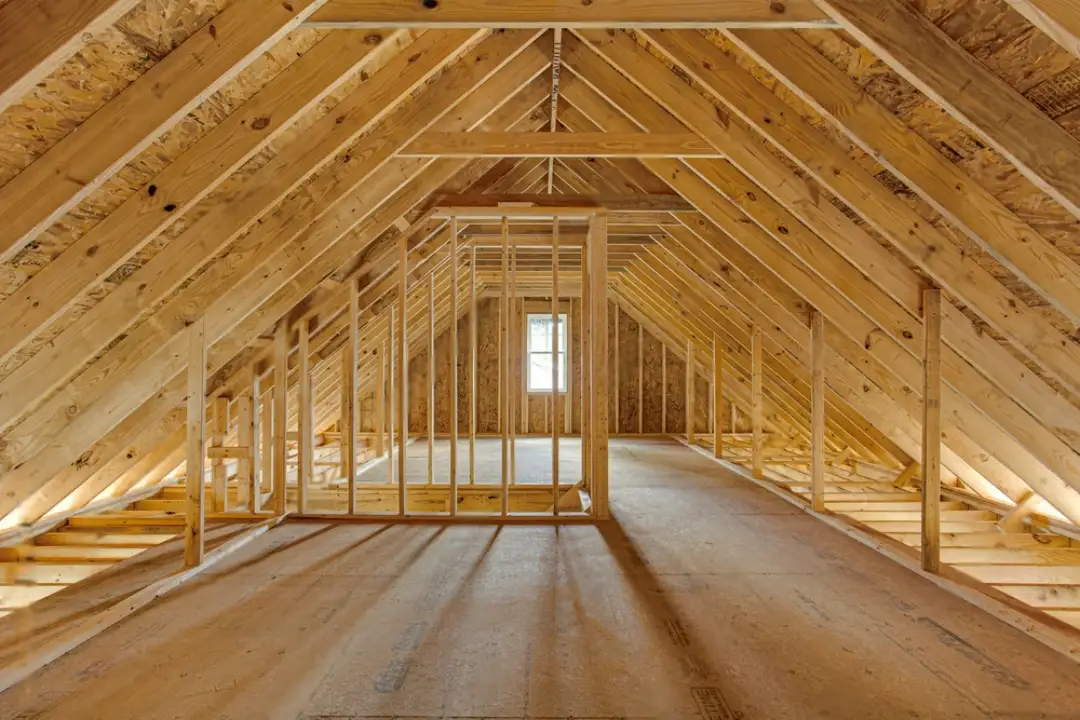 Luxury Home Renovations Perth Exposed timber roof trusses and wall framing in an open attic space