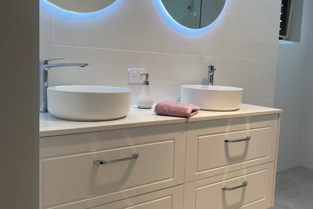 Bathroom Renovations Bayswater White double vanity with two round basins and backlit round mirrors